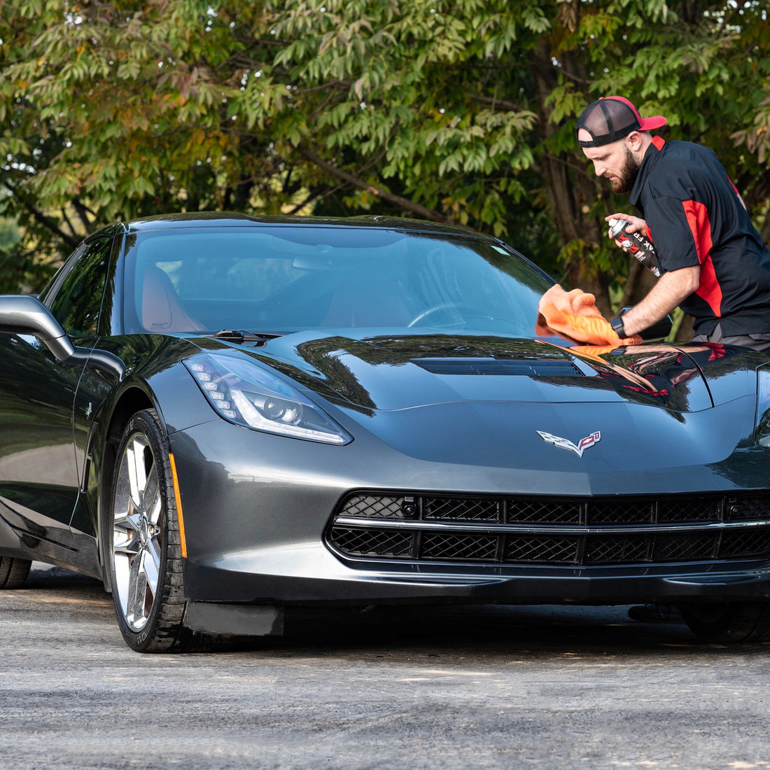 Brandon detailing a grey Corvette
