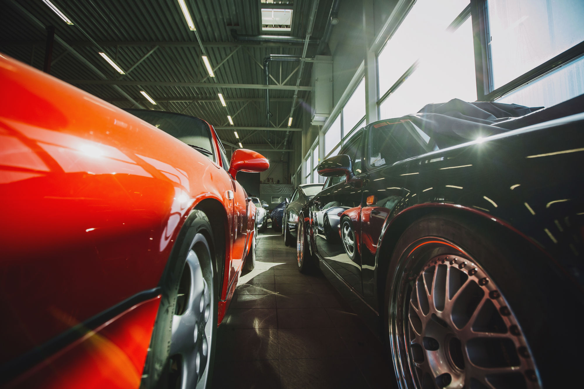 Two show-quality sports cars gleaming in the Branded Detailing shop