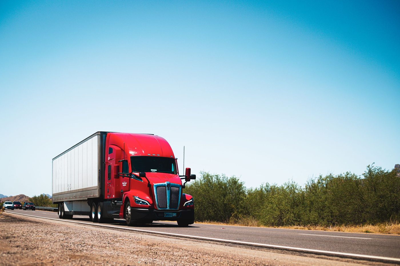 A semi tractor and trailer on the highway